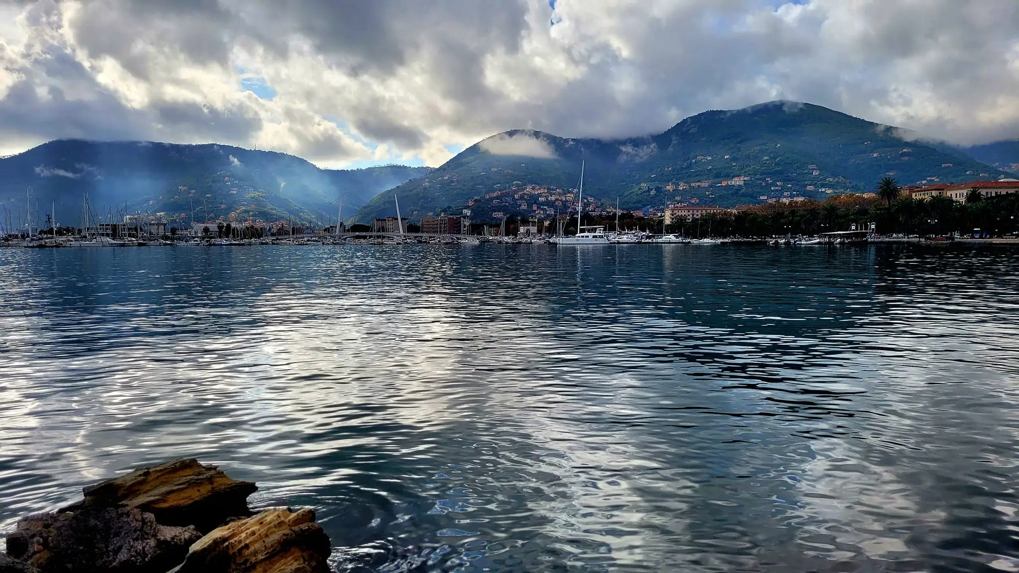 first point view seaside of La Spezia with mountain range in the background